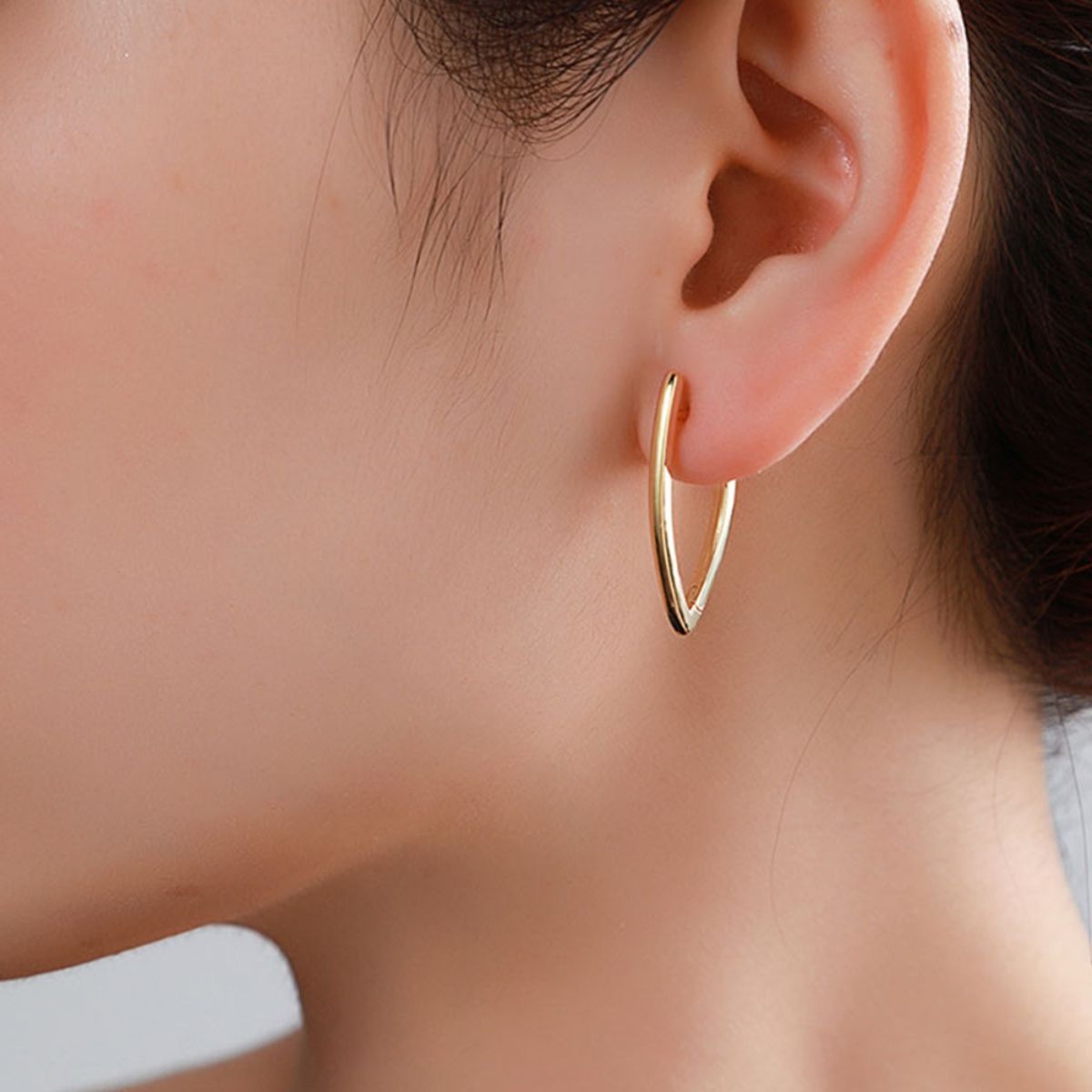 Stylish silver earrings with abstract V shape, perfect for modern looks.