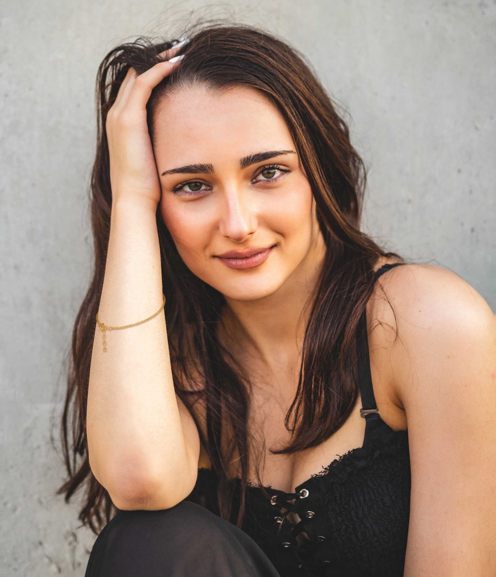 Gilded Dreams Bracelet in 18K gold plated on model's wrist, showcasing elegant design and sophistication.