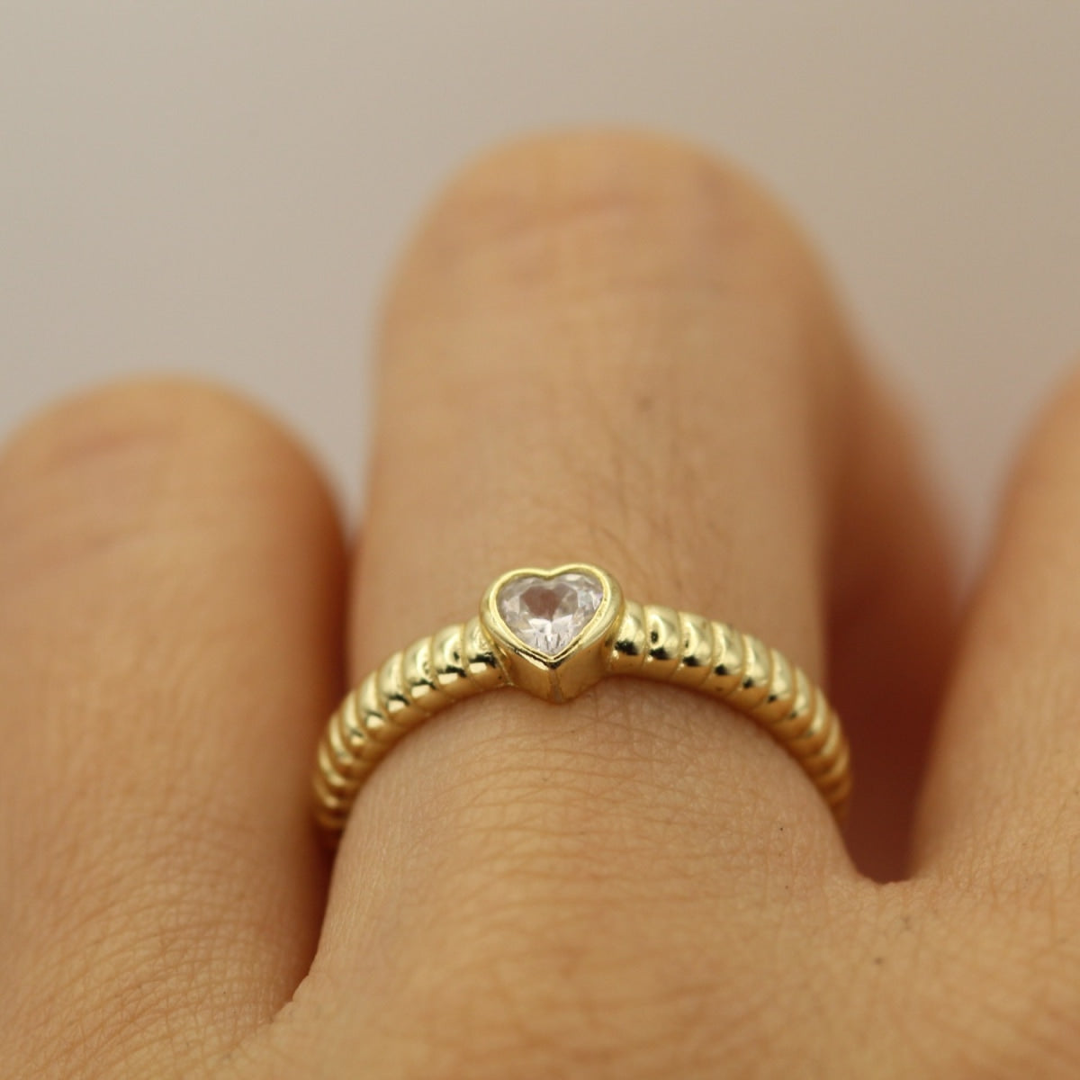 Golden Orbit Ring featuring cubic zirconia and rich gold finish