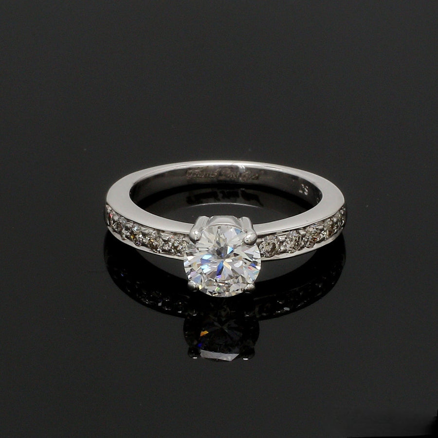 Minimalist silver ring with round cubic zirconia, perfect for stacking.