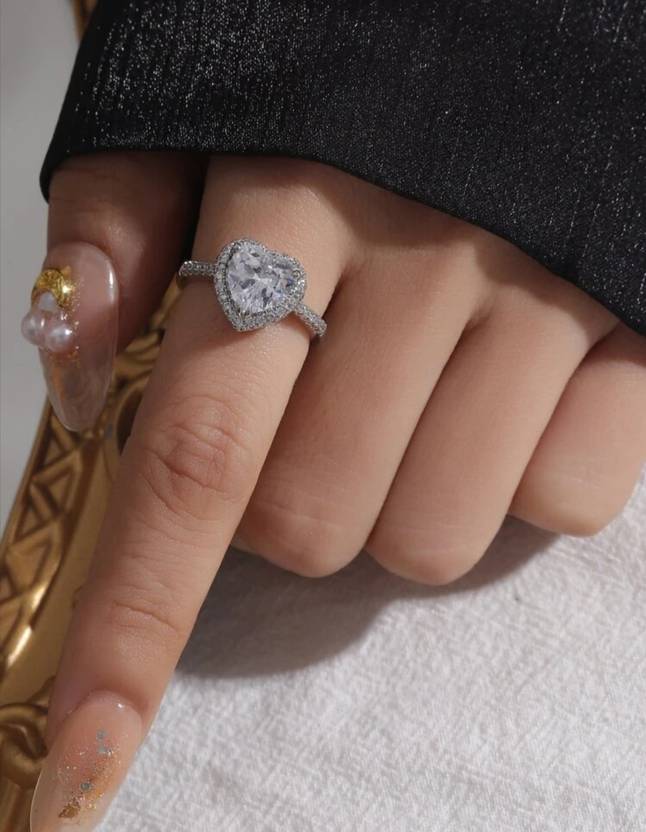 Elegant silver ring featuring a cubic zirconia heart design.