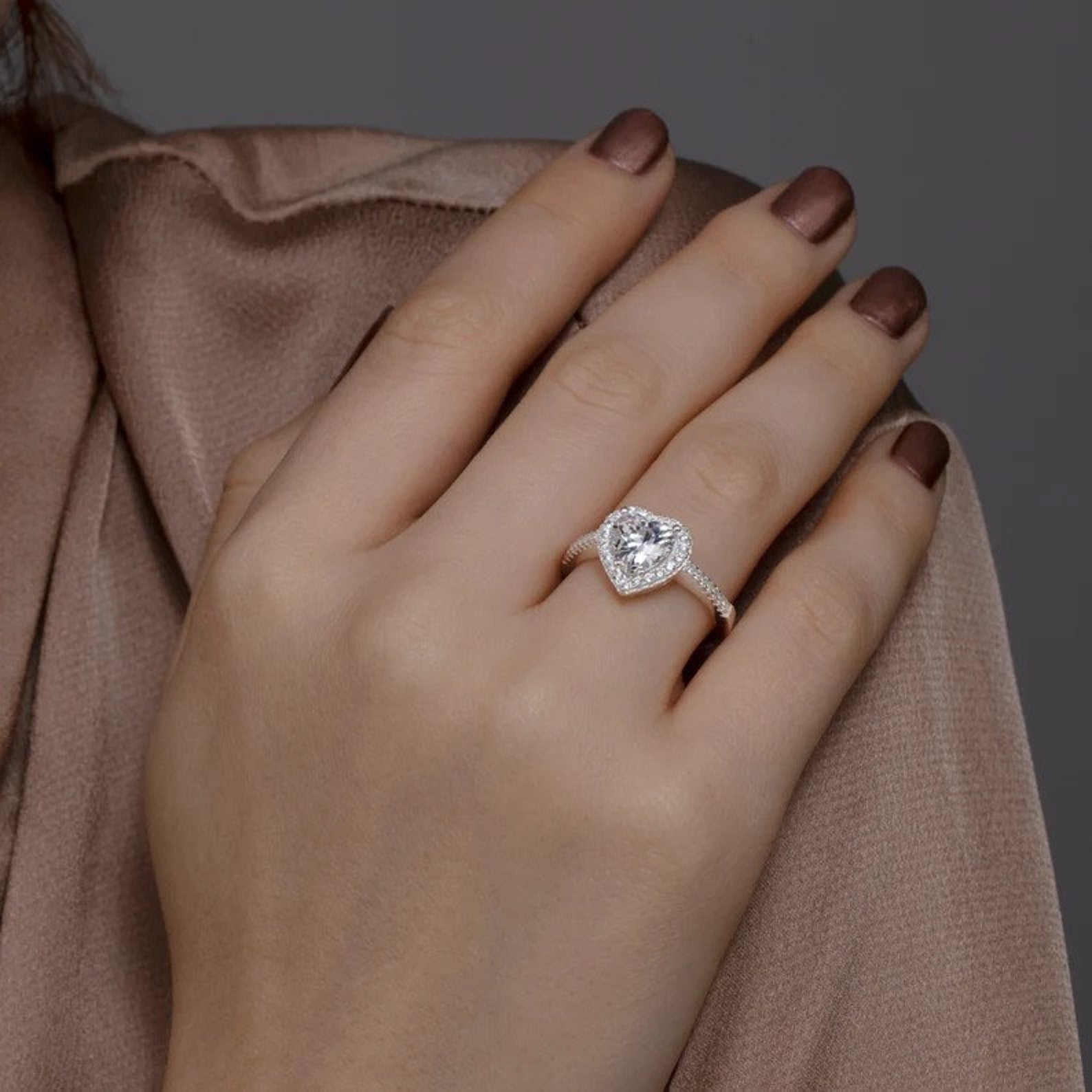 Romantic heart ring crafted in rhodium-plated silver.