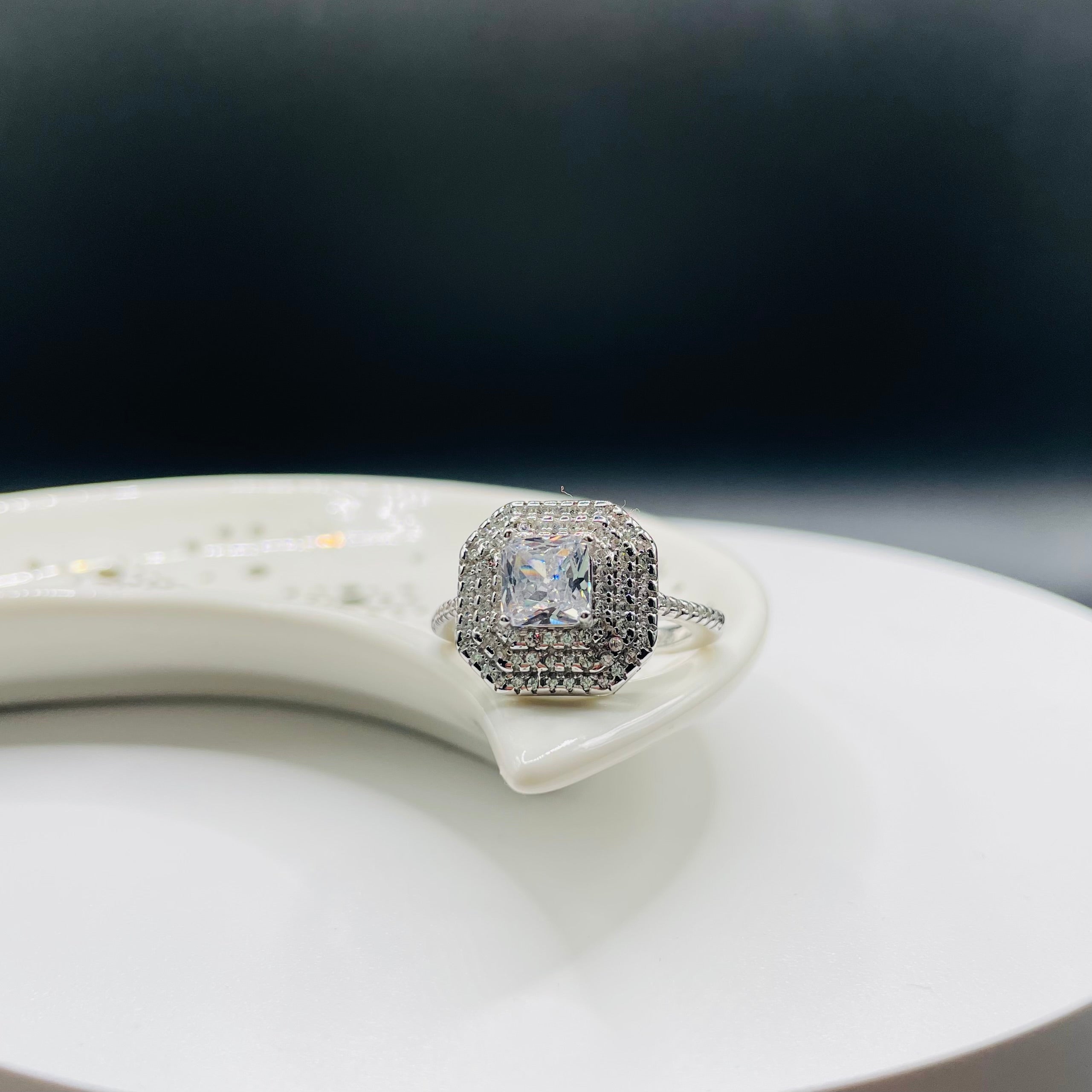 Elegant double halo ring with princess-cut cubic zirconia center