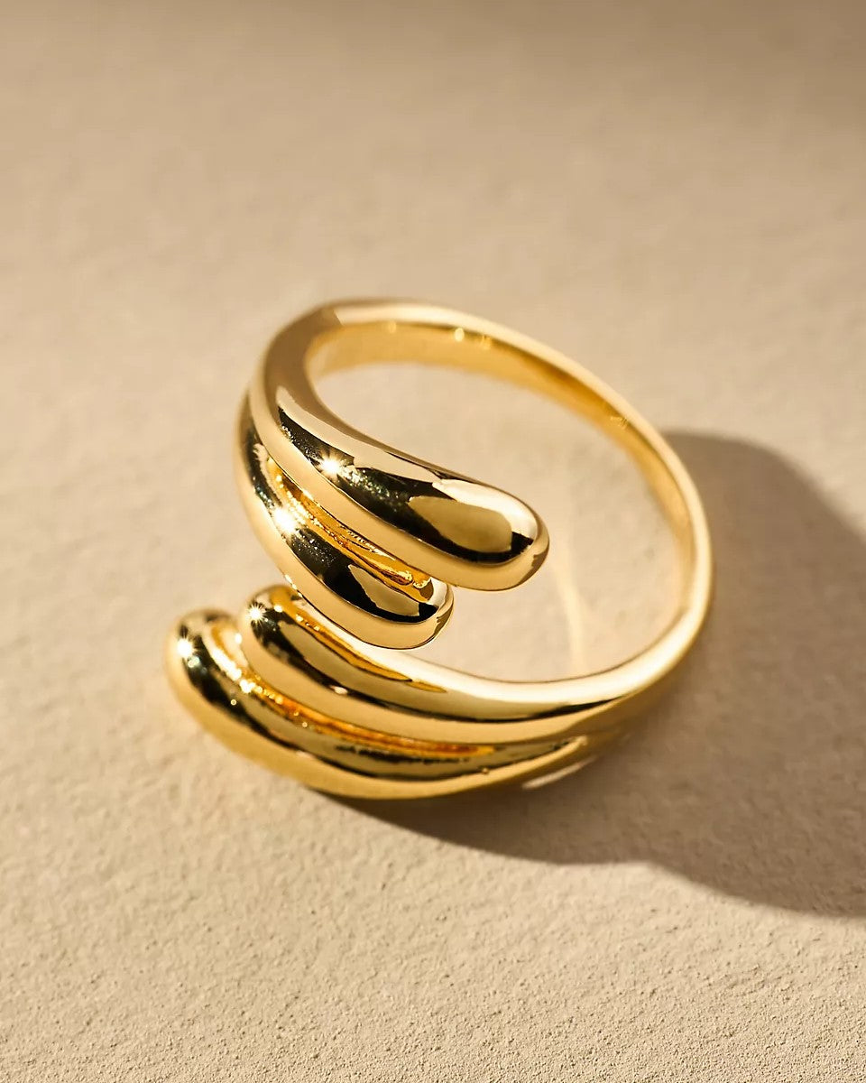 Elegant silver ring featuring a twisted band and sparkling crystal details.