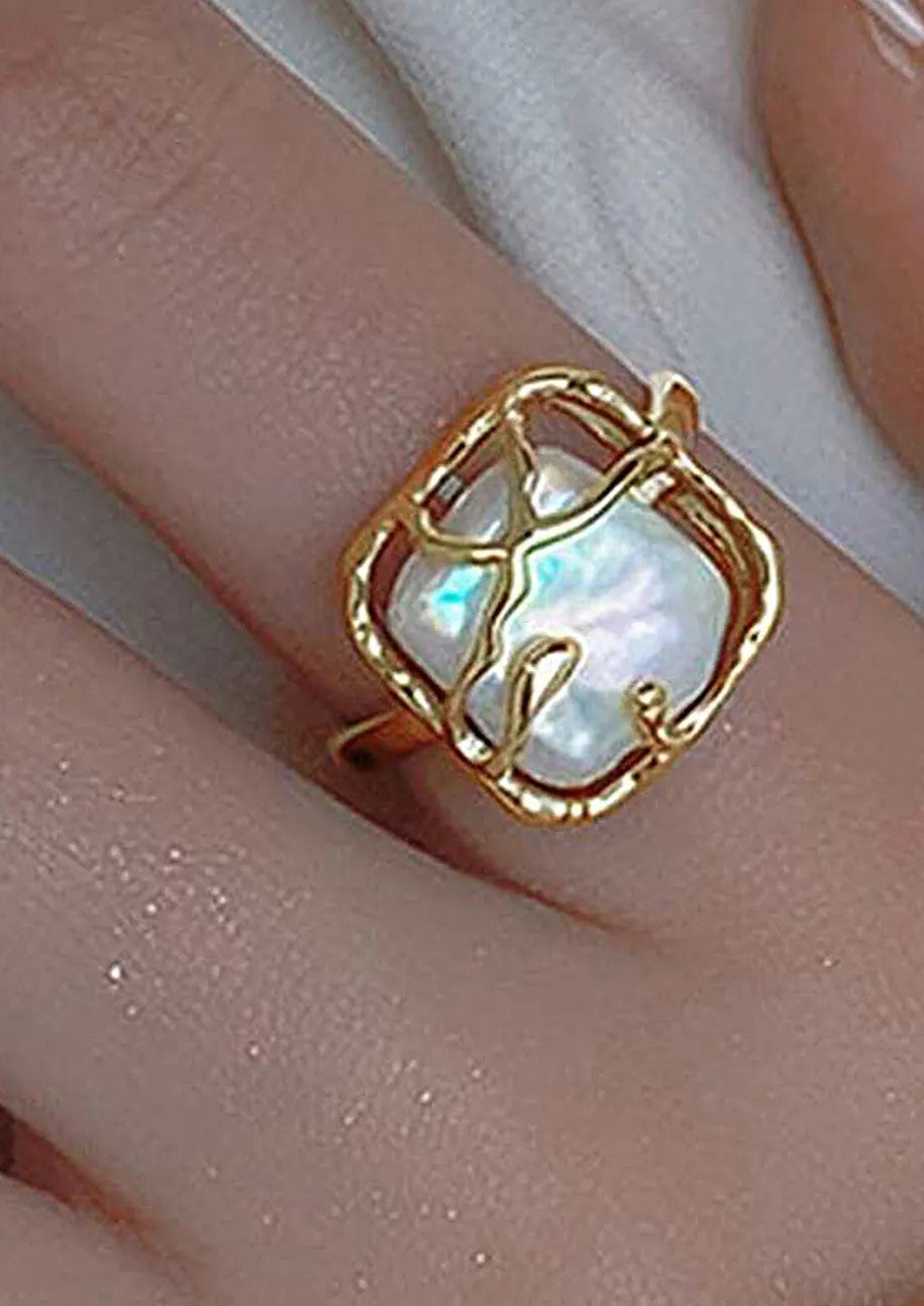 Close-up of Moonlit Pearl Ring with a round pearl centerpiece.