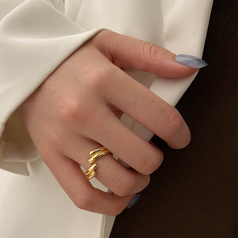 Close-up of Affinity Ring with a symbolic, connected band design.