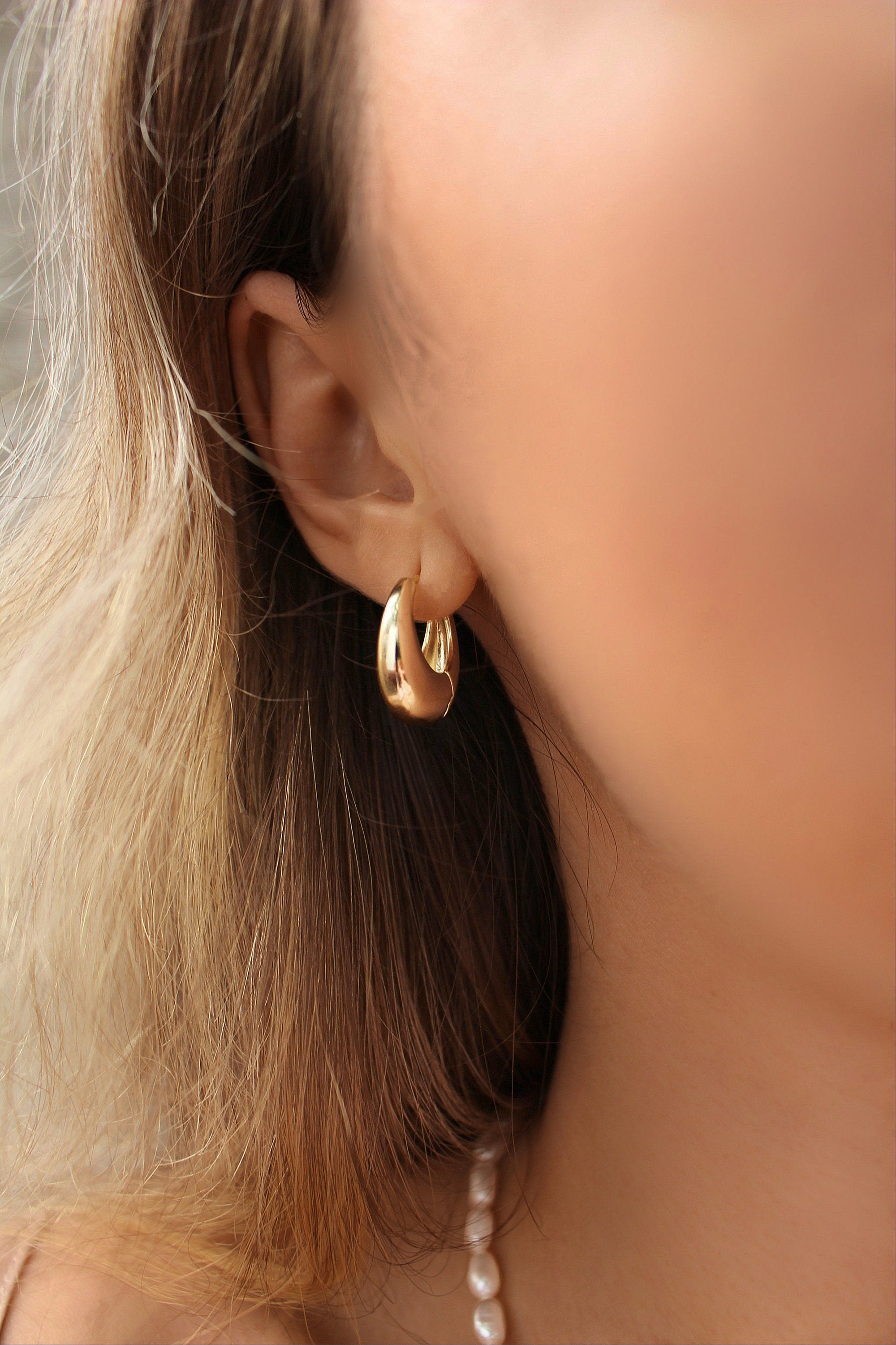 Curved drop earrings in gold plating—designer earrings online India