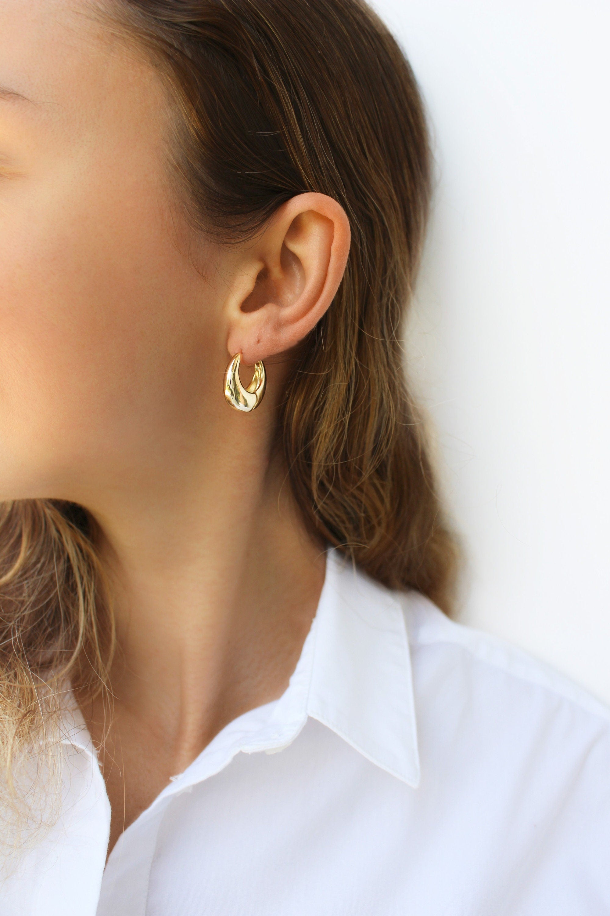 ISHI New York earrings—modern gold-plated teardrop design
